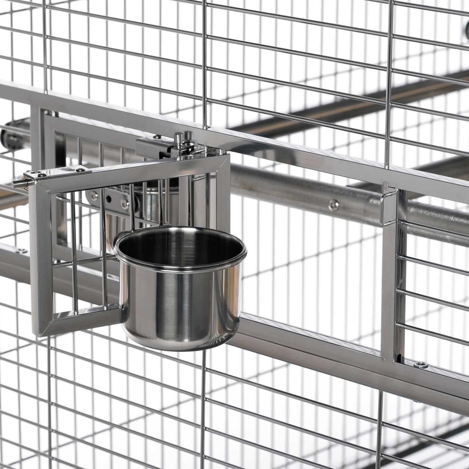 Metal bird cage with a water dish attached