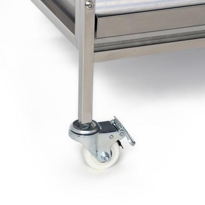 Stainless steel caster wheel on a white background